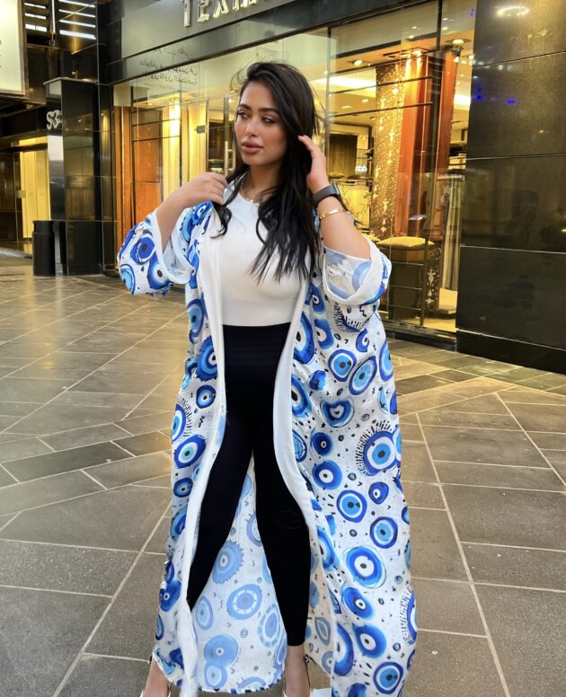 Stand out in a kaftan designed with iconic eye details.