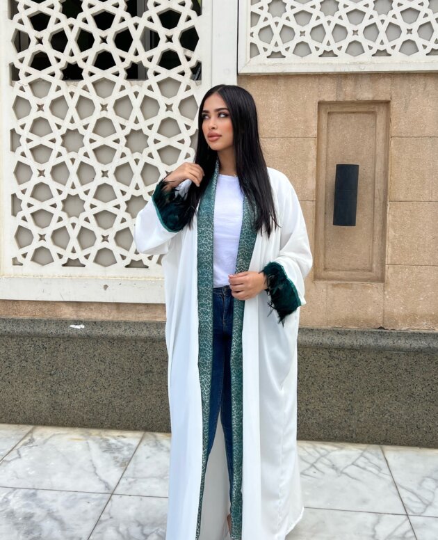 Stand out in a white feathered kaftan made just for you